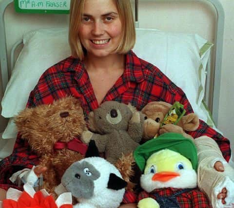 Lisa recovering in hospital with some of the gifts donated by well-wishers