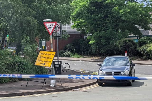 A VW Polo and bicycle behind the police cordon at the junction of Lower Rushall Street and Walhouse Road in Walsall