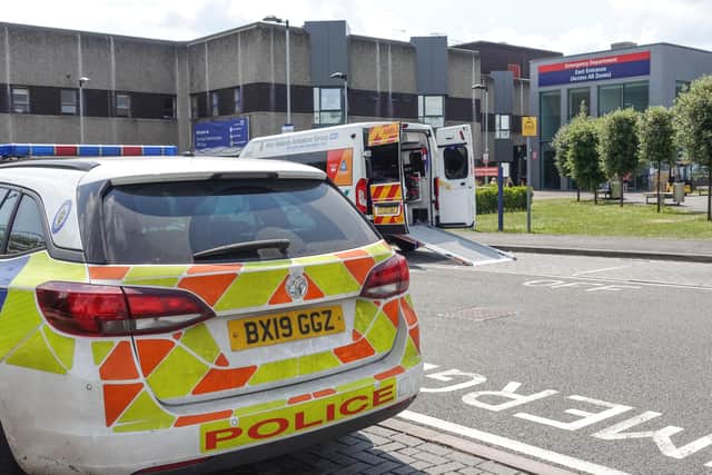 Police at the Emergency Department entrance of New Cross Hospital in Wolverhampton after a member of staff was stabbed. Photo: SnapperSK.