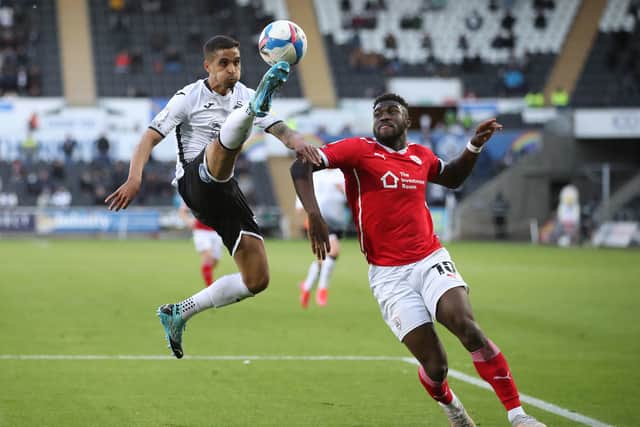 Swansea City's Kyle Naughton (left) and Barnsley's Daryl Dike