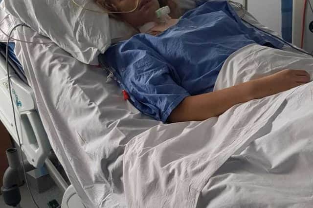 Charlotte 'Lotte' Whittle receives treatment in hospital.
