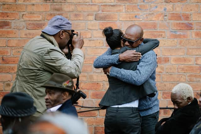 Daughter Natalie Barnes is comforted