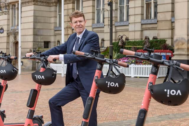 Mayor of the West Midlands Andy Street with some of the rentable scooters 