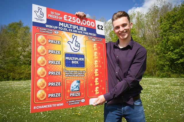 Luke Ashman is celebrating after his scratchcard win
