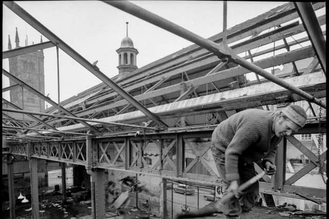 George captured one of the demolition men shovelling rubble from just beneath the roof beams