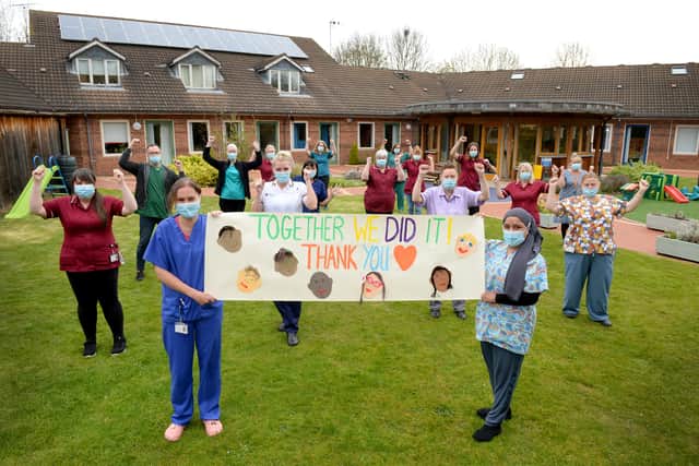 Staff members at Acorns Children's Hospice in Walsall celebrate after the hospice was saved from the threat of closure.