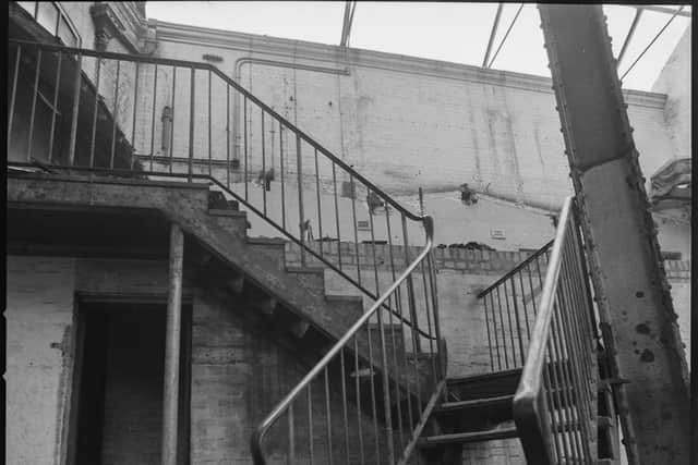 The stairs inside the shell of the empty building