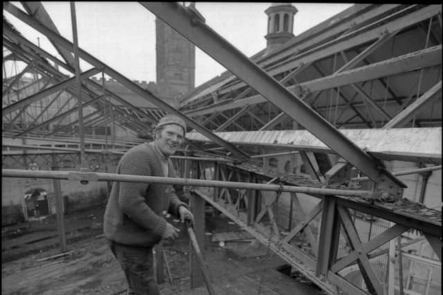 George captured one of the demolition men shovelling rubble from just beneath the roof beams