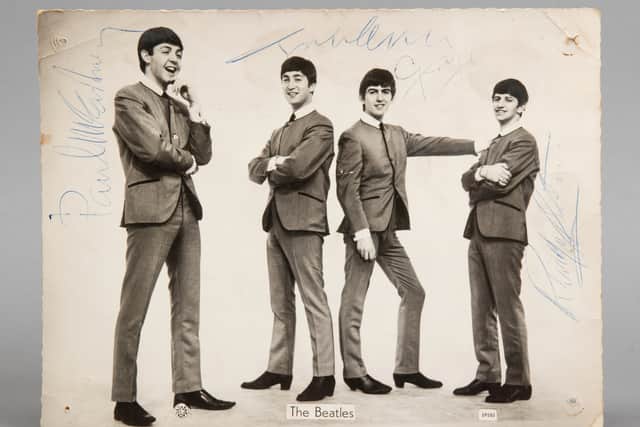 The photo signed by all four members of The Beatles