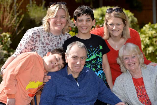 Leonard is pictured with wife Pat, grandchildren Adam and Jack and daughters Karen and Becky