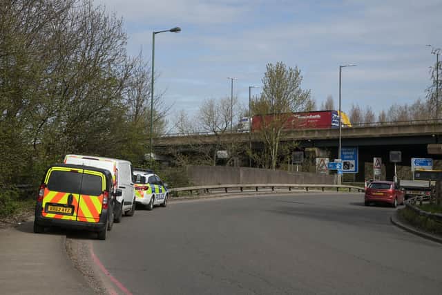 Police at the scene next to Junction 9 of the M6 where human remains were found. Photo: SnapperSK