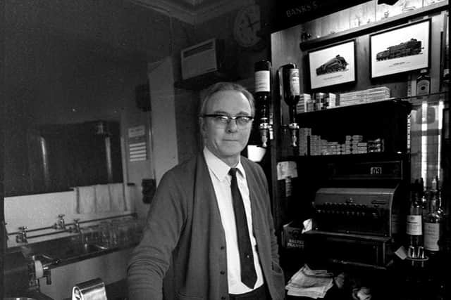 A man behind the bar in one of George Foster's old pictures
