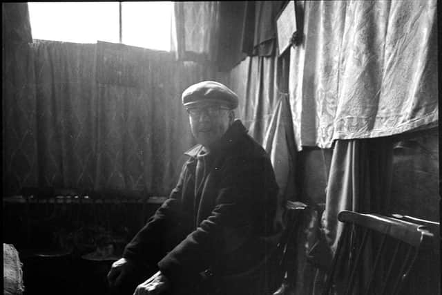 A man waiting for a haircut at Teddy McGovan's barbershop