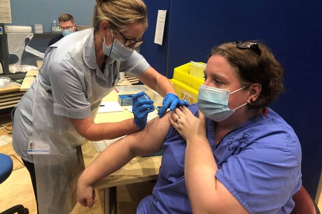 Dr Elin Roddy, a consultant respiratory physician, getting her jab