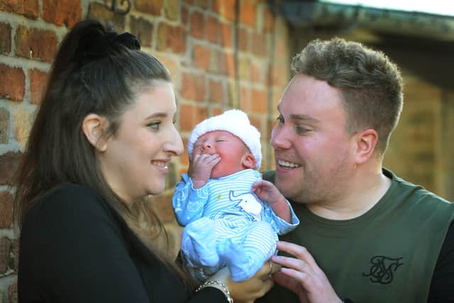 Roman Gray Hulme, parents Lexi Shinton, and David Hulme
