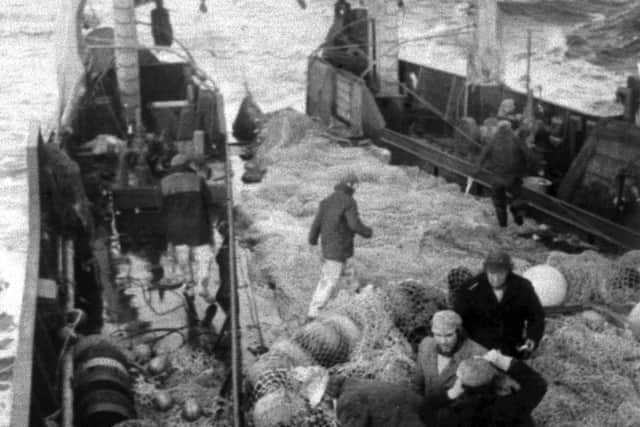 Repairing a badly damaged net aboard the Flydea in December 1975