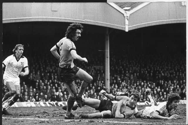 Geoff Palmer clears the danger.