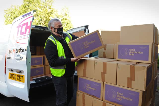Ian Brookfield, leader of Wolverhampton Council, helps deliver food parcels