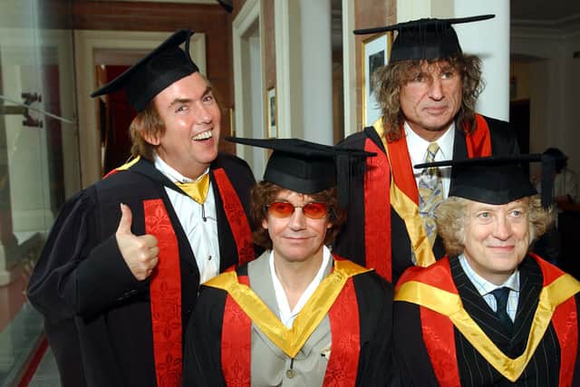 Dave Hill, Jim Lea, Don Powell and Noddy Holder collect their honorary followships from the University of Wolverhampton in 2002