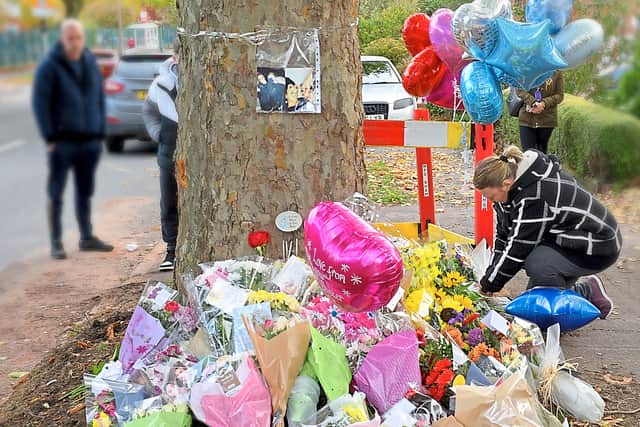 Flowers, balloons and cards have been left at the crash scene
