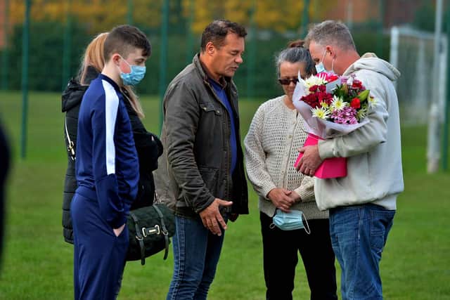 School chaplain pastor Nigel Rowe spends time with Lucy's mom Zoe Bence, stepdad Simon Bence and family