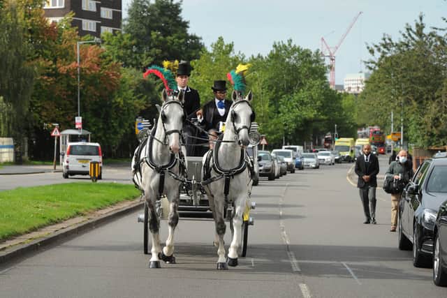 Her coffin was placed in a white carriage pulled by horses