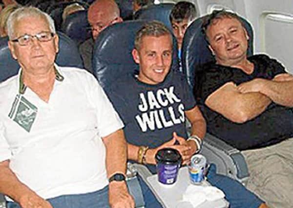Joel Richards, centre, with his uncle Adrian Evans, left, and grandfather Patrick Evans