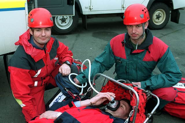 Stafford RAF Mountain Rescue. Pictured L-R: corp Tim Sugars and SAC Colin Little "giving oxygen" to sergeant Kevin Hewkin during training.