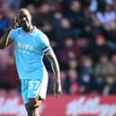 Walsall star Albert Adomah is set to become the first player to make 100 appearances for six different clubs in English football’s top four tiers.