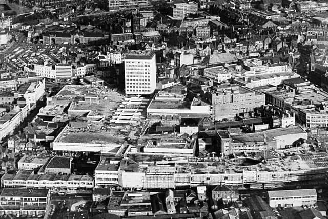 March 2, 1968, and aerial view across Wolverhampton, the caption reads: 'Although the Mander Centre, Wolverhampton, was formally opened by the Mayor, Alderman E Y Fullwood today, and while the tower office block to the centre is partly occupied, the centre is still very much a shell plus much-needed parking for about 550 cars. Really what was opened today is a series of pedestrian walkways through the centre. Two or three shops are ready for business. Many more are to come, but for some time the centre will be a place of vacant boxes that one day will be shops. Among those to come include a 54,000 square feet department store for Owen Owen, a Tesco supermarket, and a Timothy White and Taylors shop, to name but a few.'