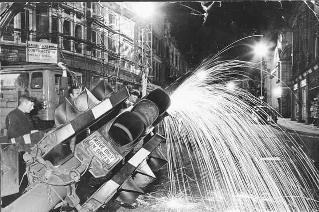 The dismantling of Wolverhampton's historic first traffic lights in 1968.