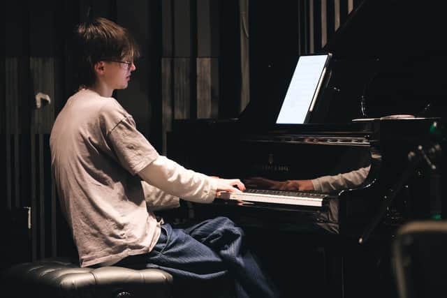 Alex Miranda Zezula (He/Him) Music Supervisor / Musical Director on the piano