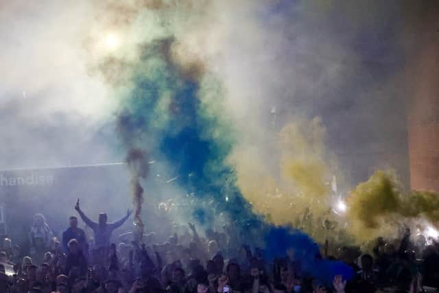 Smoke bombs were let off outside the ground. Photo: AMA