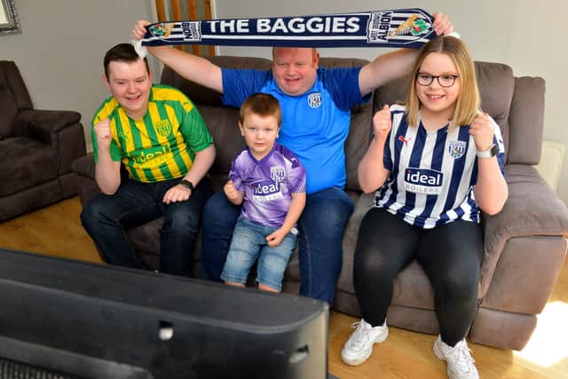 Getting ready for the big game: Dad Alistair Jones with son Oliver Jones, five, daughter Millie Jones ,14, and son Liam Jones,17