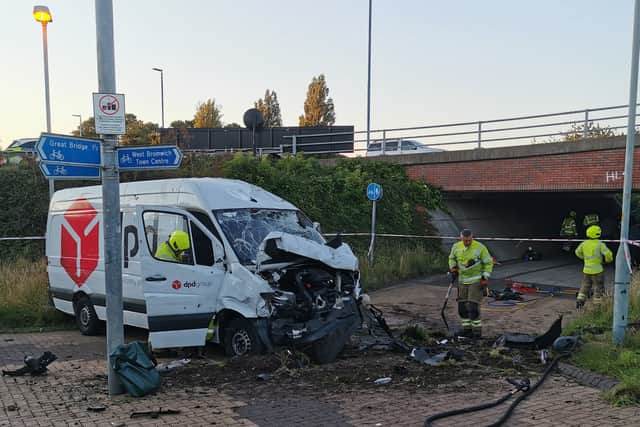 DPD driver arrested as van ends up near subway after roundabout crash