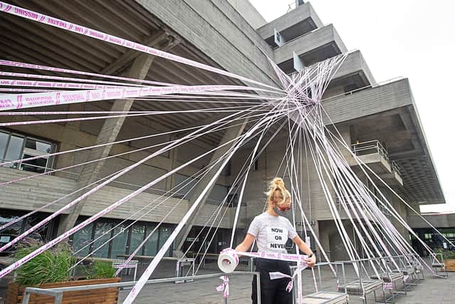 The National Theatre in London wrapped in tape for the #MissingLiveTheatre campaign