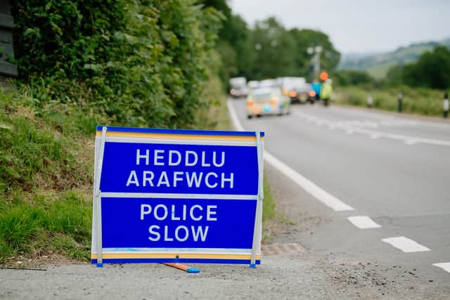 A police sign on the A458