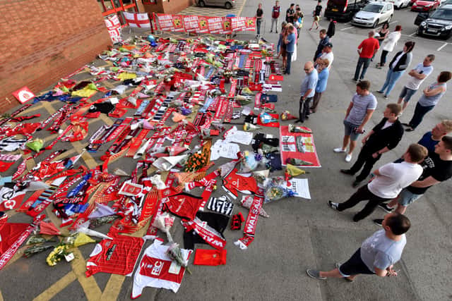 A huge amount of tributes laid next to the entrance of Walsall FC's Bescot Stadium