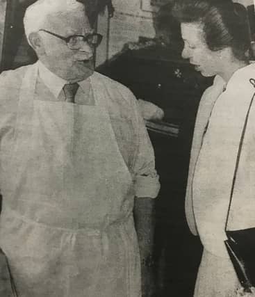 The Princess Royal talks to Frank Egan, who demonstrated the craft of edging leather.
