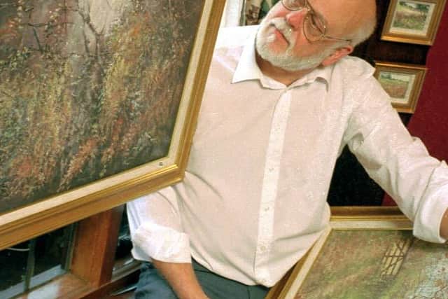 Nigel Hallard with one of his paintings at an exhibition in Kidderminster in 1995