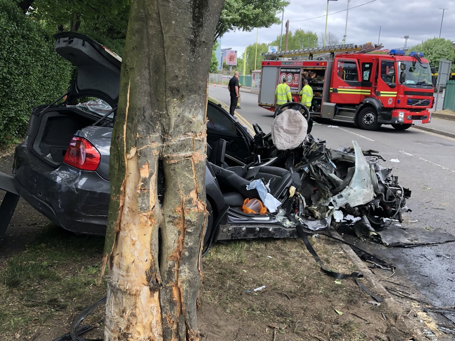 Man trapped in wreckage for an hour after car hits tree