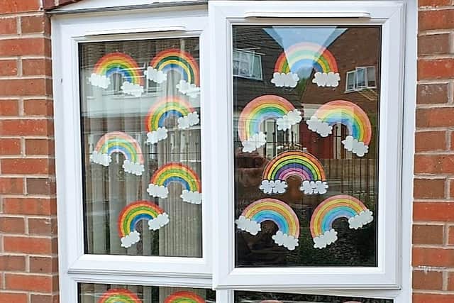 Rainbows painted on the windows at Dimensions