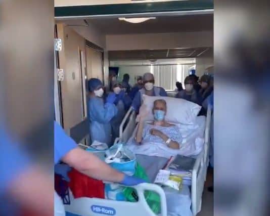 Peter being cheered by staff in hospital as he recovered from Covid-19