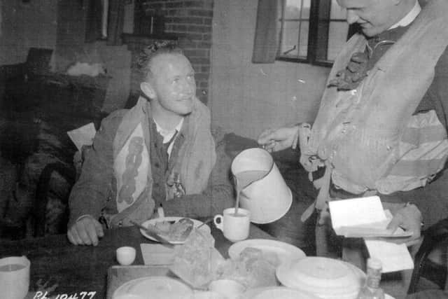 Shown on the right, pouring tea between wartime sorties, is Flight Lieutenant William Thomas Johnstone, who was killed when "The Wulfrun" was lost in action.