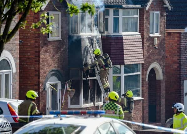 Police hunt arson suspect after house set on fire with woman and ...