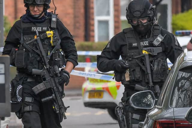Armed police in Birmingham Road, West Bromwich, on Monday. Photo: SnapperSK