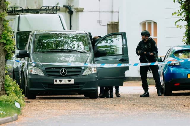 Armed police next to the cordon in Birmingham Road