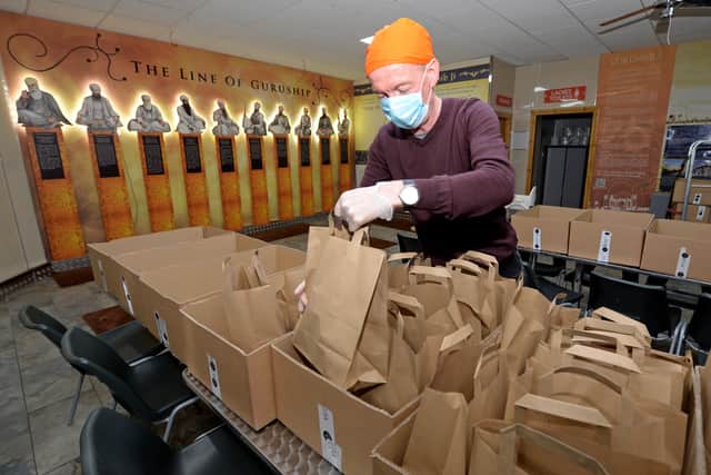 Wolverhampton South East MP Pat McFadden packs some of the food parcels