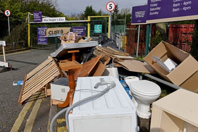 A toilet, cardboard and a mattress are among rubbish left outside the closed Shaw Road Recycling Centre