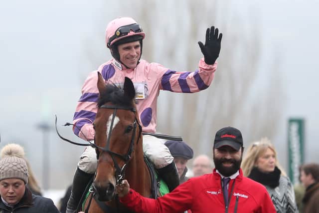 Harry Skelton celebrates his victory on Oldgrangewood in the Paddy Power Handicap Chase during the New Year's Day meeting at Cheltenham Racecourse